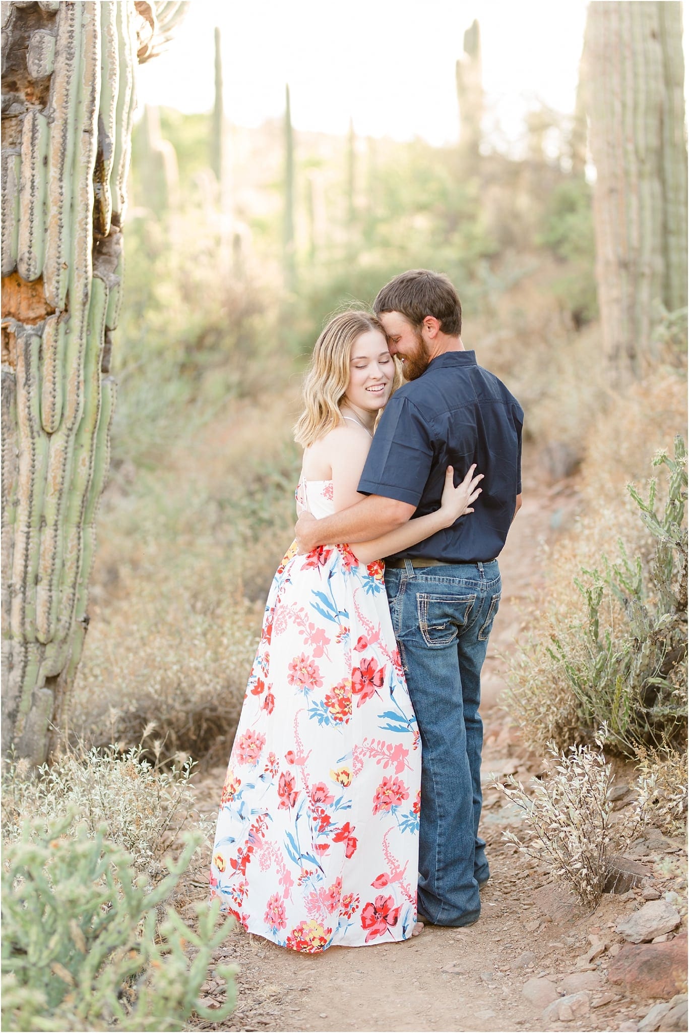 couple embracing in cave creek engagement 