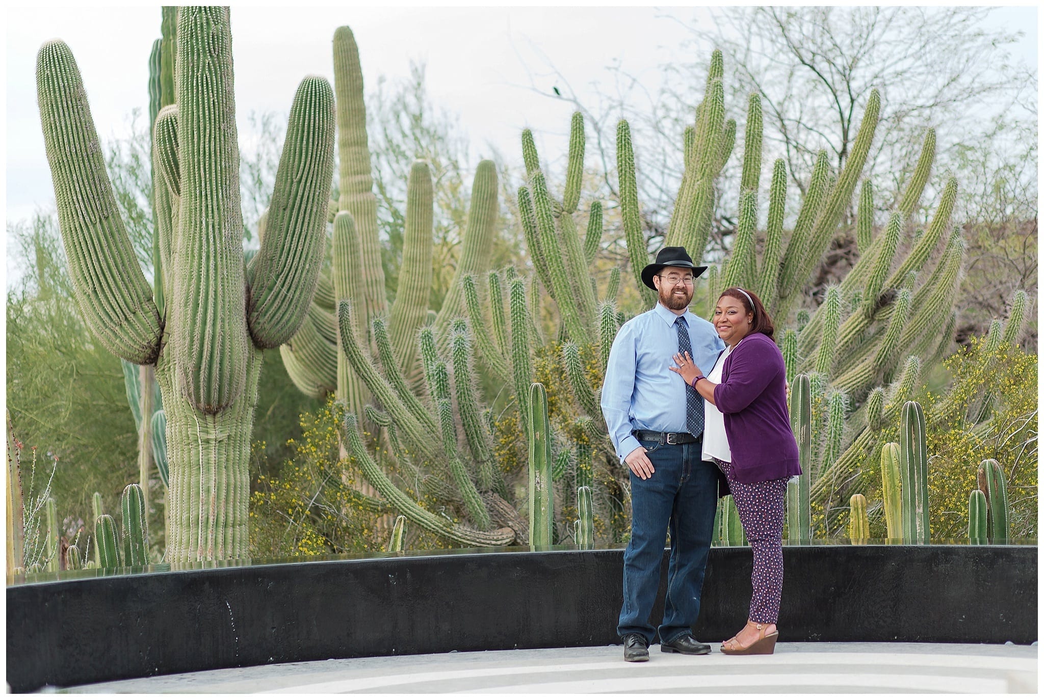 couple standing in cactus garden