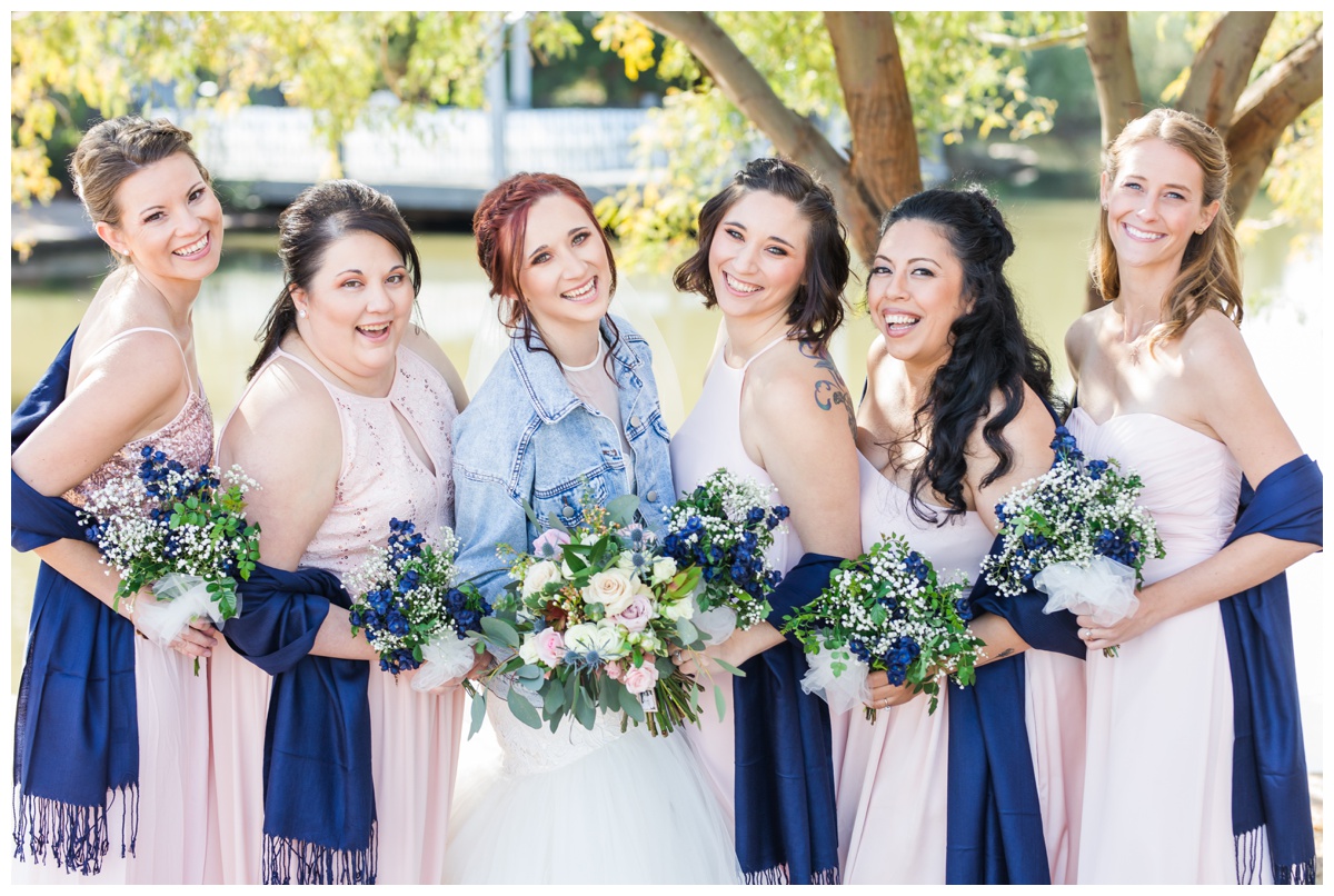 Bridesmaids smiling in blush dresses