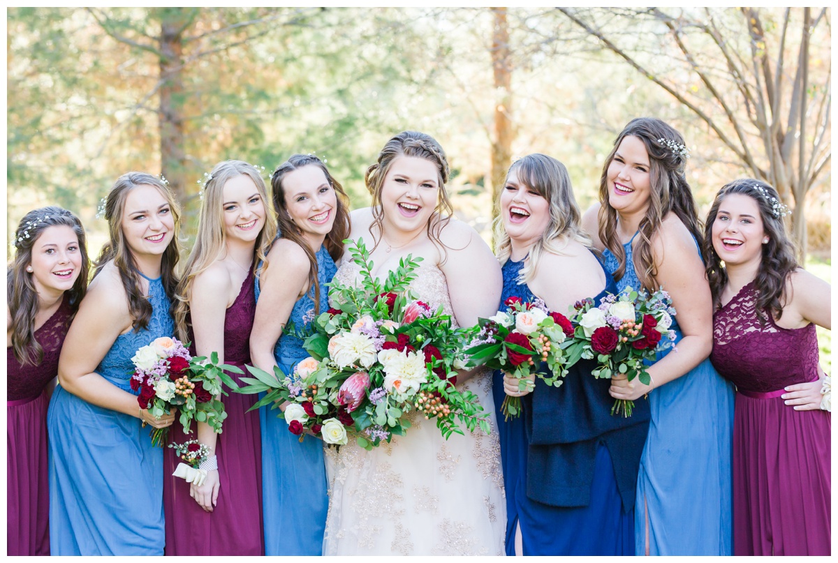 Light blue, navy, blush gowns, with bouquets of pink, white and red flowers, maroon gown
