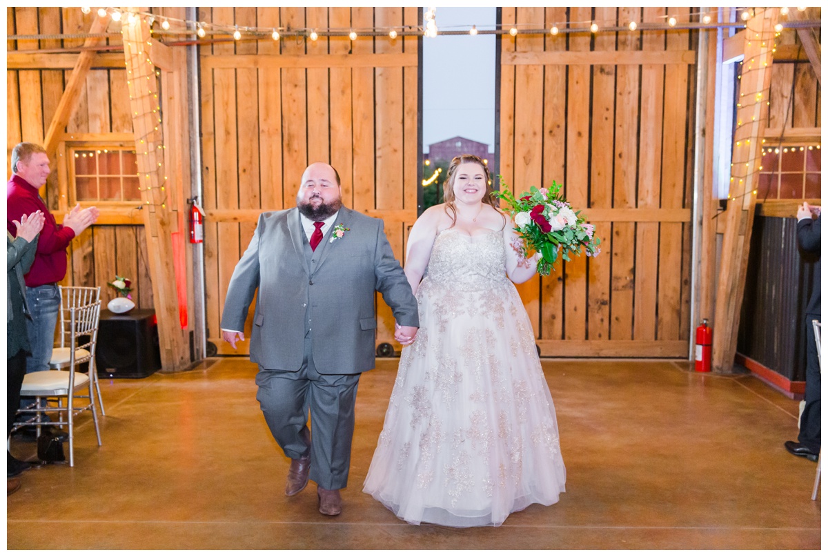 Bride and Groom enter barn