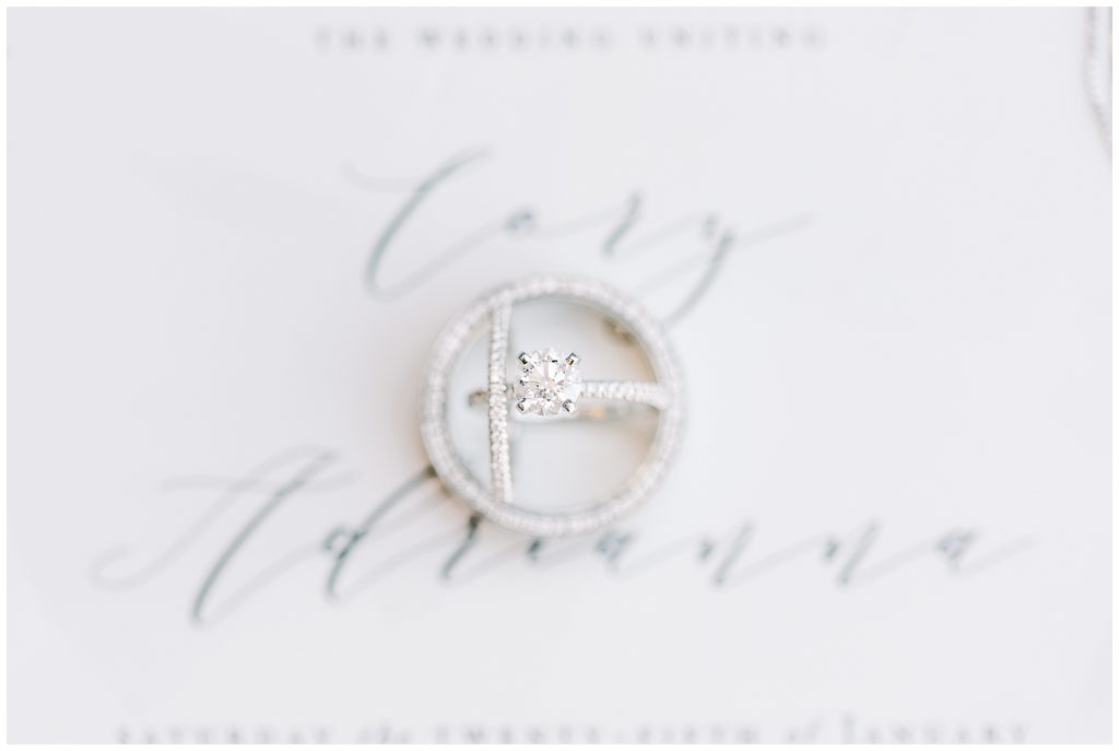 Wedding Invitation with Wedding Rings Stacked on top
