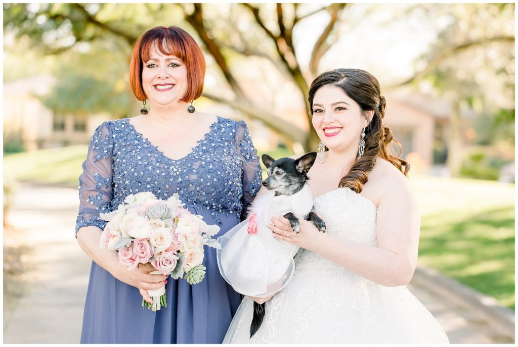 Bride with chihuahua in dress and Mother of the Bride in gown