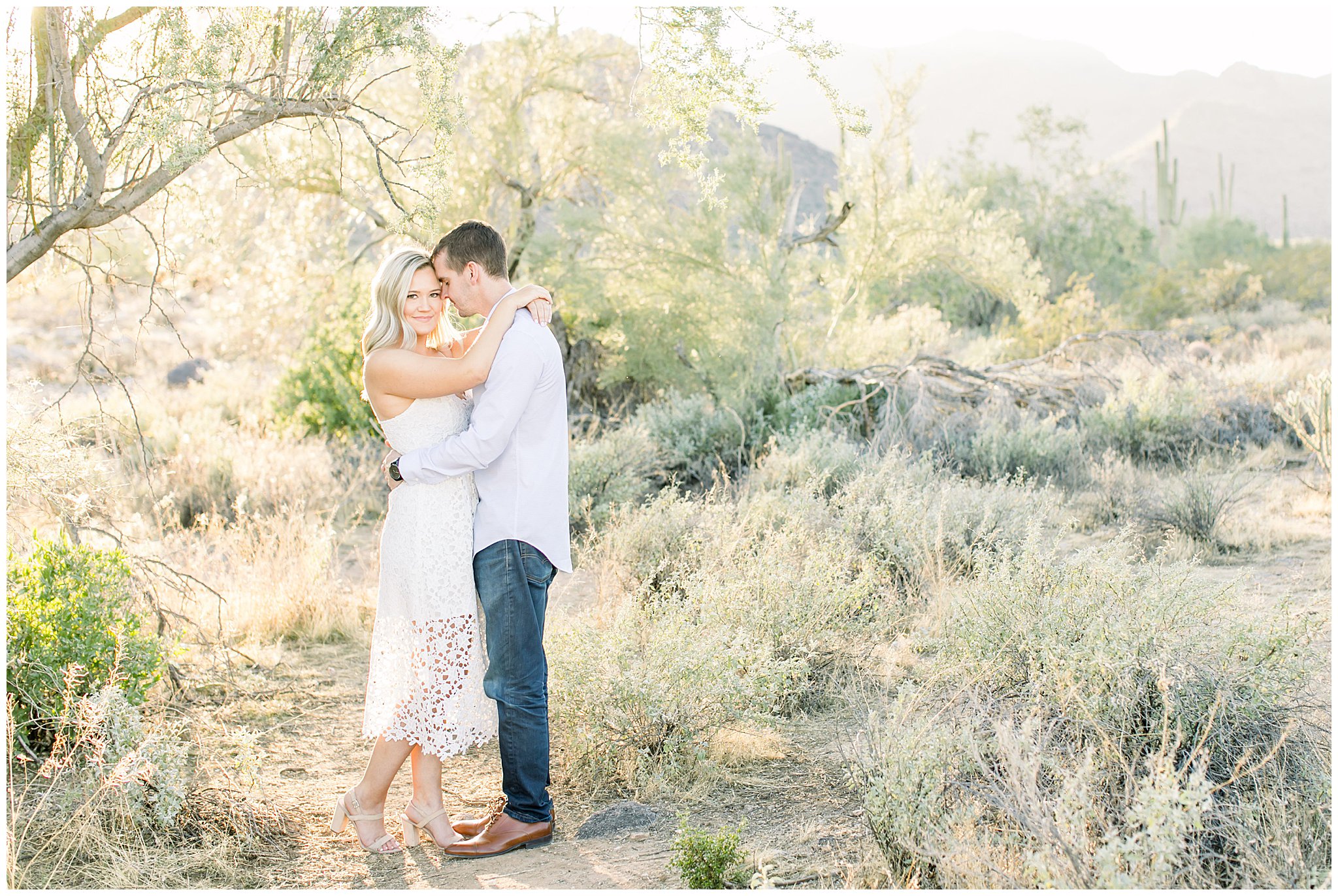 Desert engagement Pictures, Phoenix Desert Engagement Pictures, Sunset engagement Pictures, What to wear for an engagement Picture, Couple embracing, Champagne during engagement session, Champagne engagement Pictures