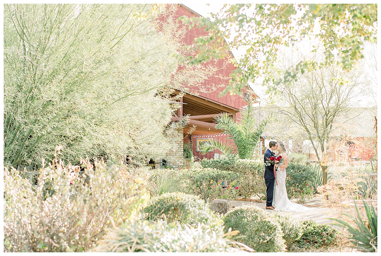 bride and groom portraits at windmill winery barn