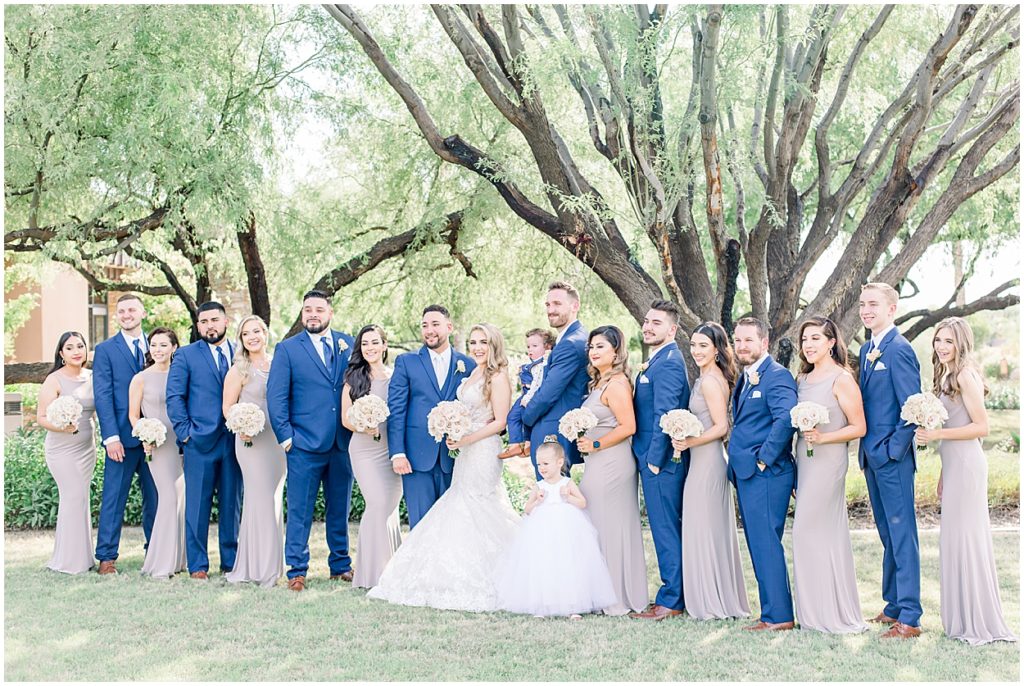 Bridal Party, Groomsmen in Blue Tuxedos, Leather Shoes, Bridesmaids in Mushroom Colored dresses, rose bouquest