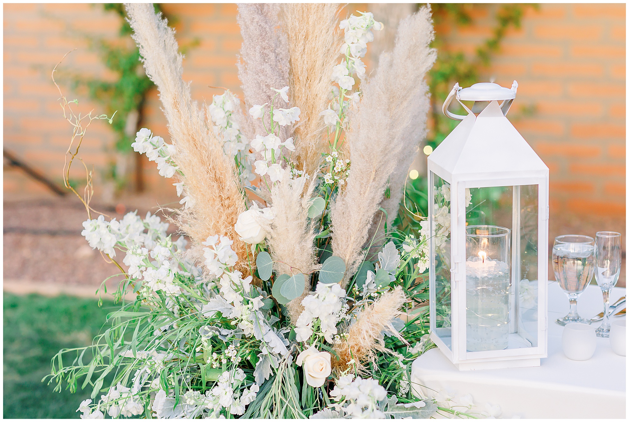 Pompous Grass, Eucalyptus, White Roses arrangement, white lantern