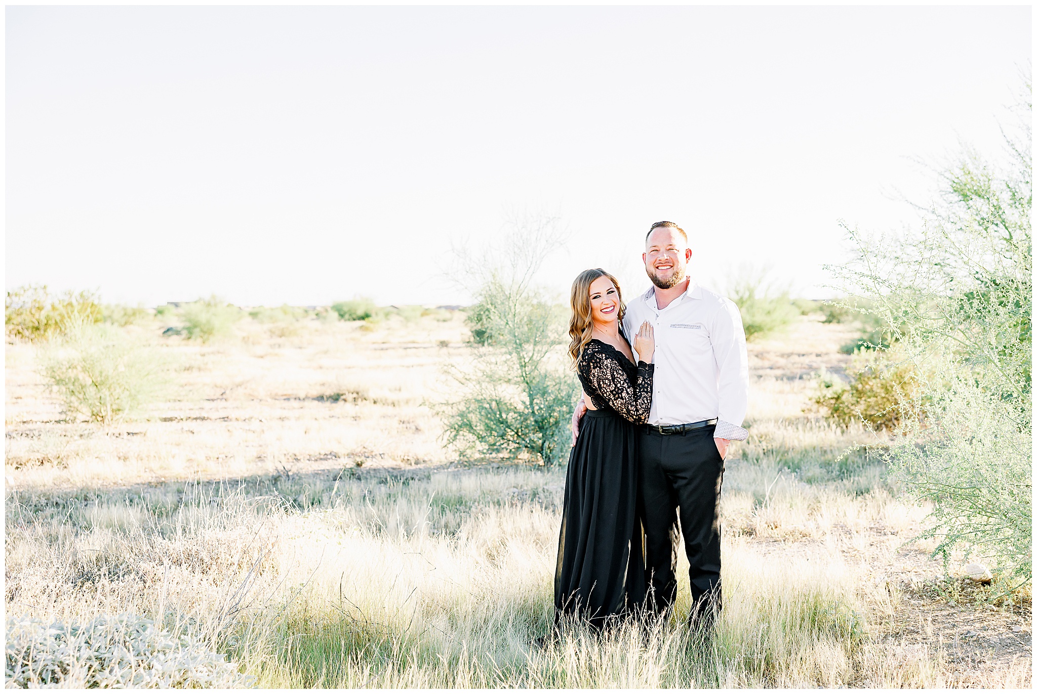 desert engagement session, couple posing in desert, black maxi dress