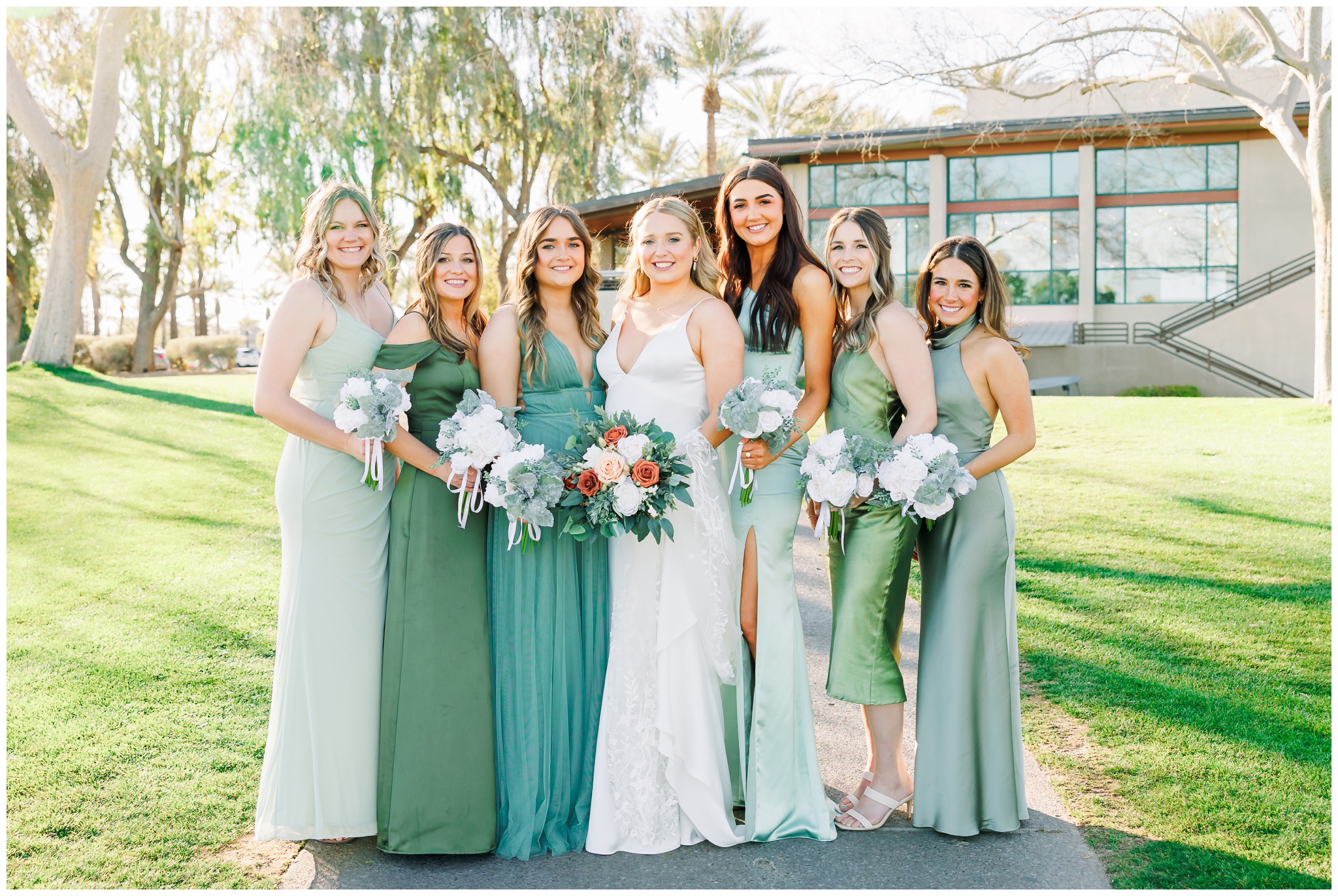 Bridesmaids in different shades of green dresses