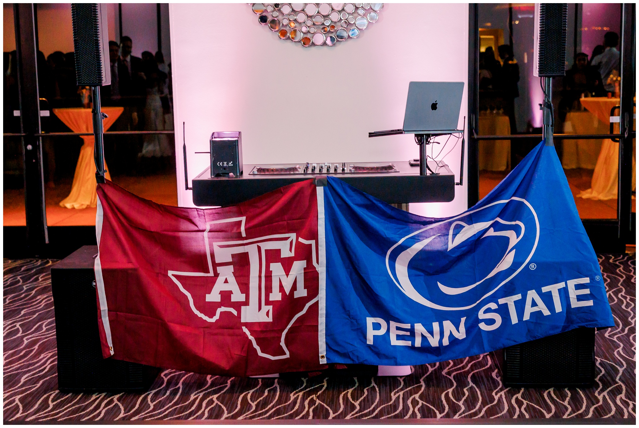 Texas A&M flag hung next to Penn State flag on DJ Booth
