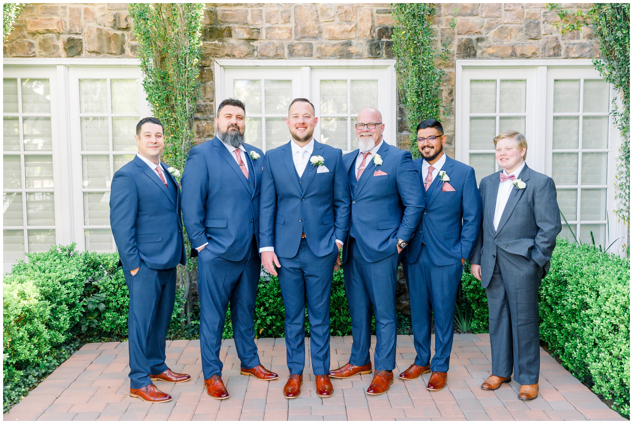 Groom with groomsmen in navy suits