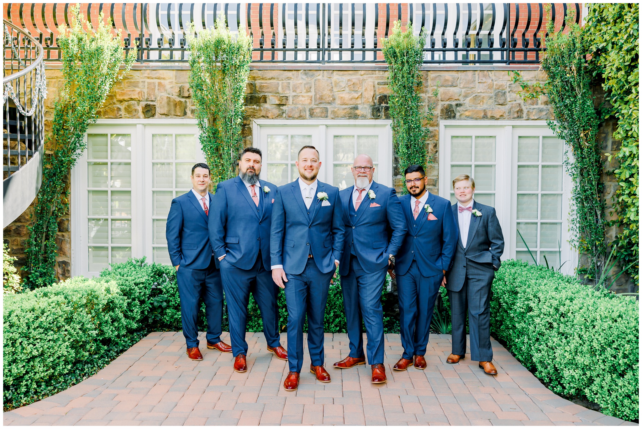 Groom with groomsmen in navy suits