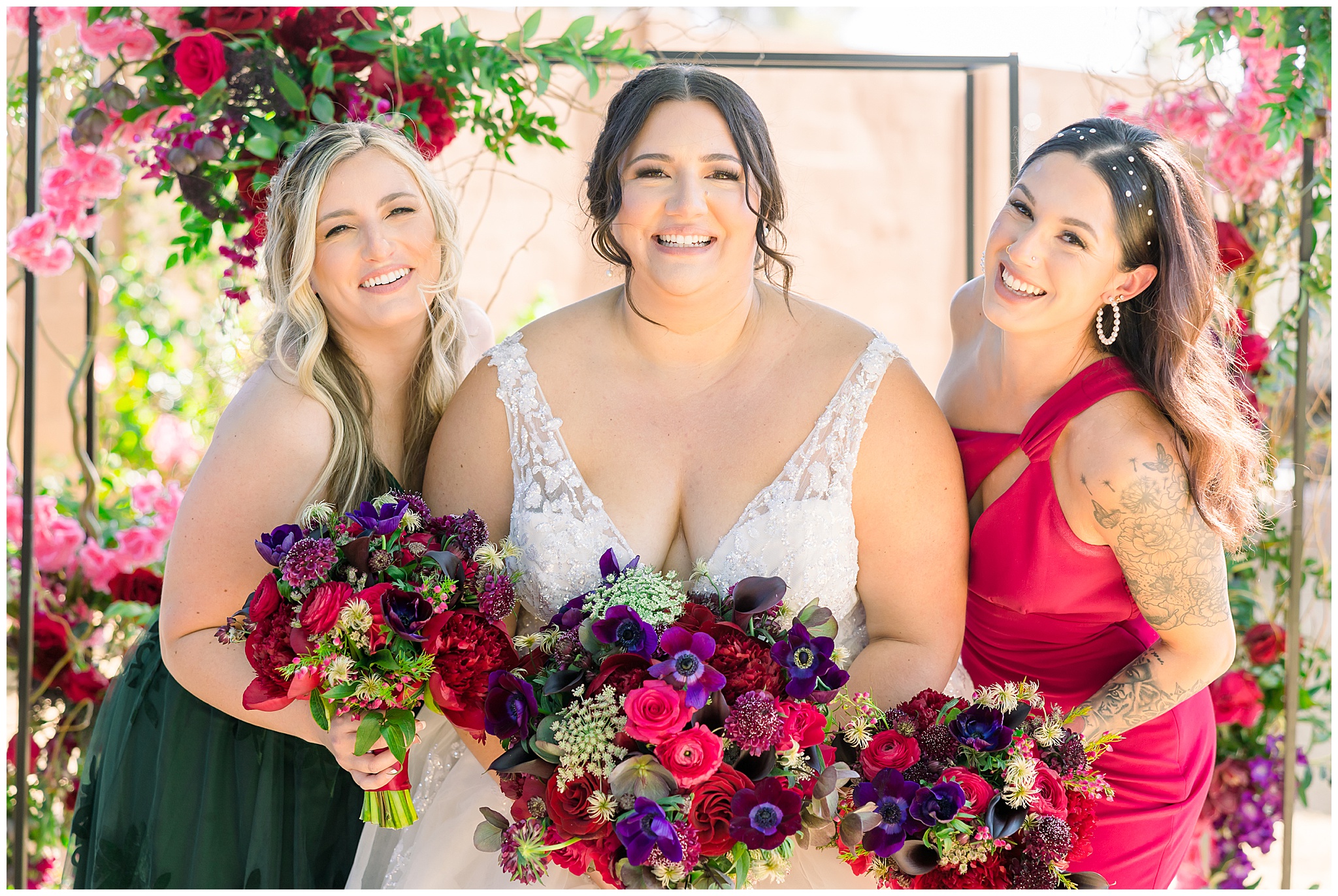 Bridesmaids with bride in pink dress, green dress with flowers