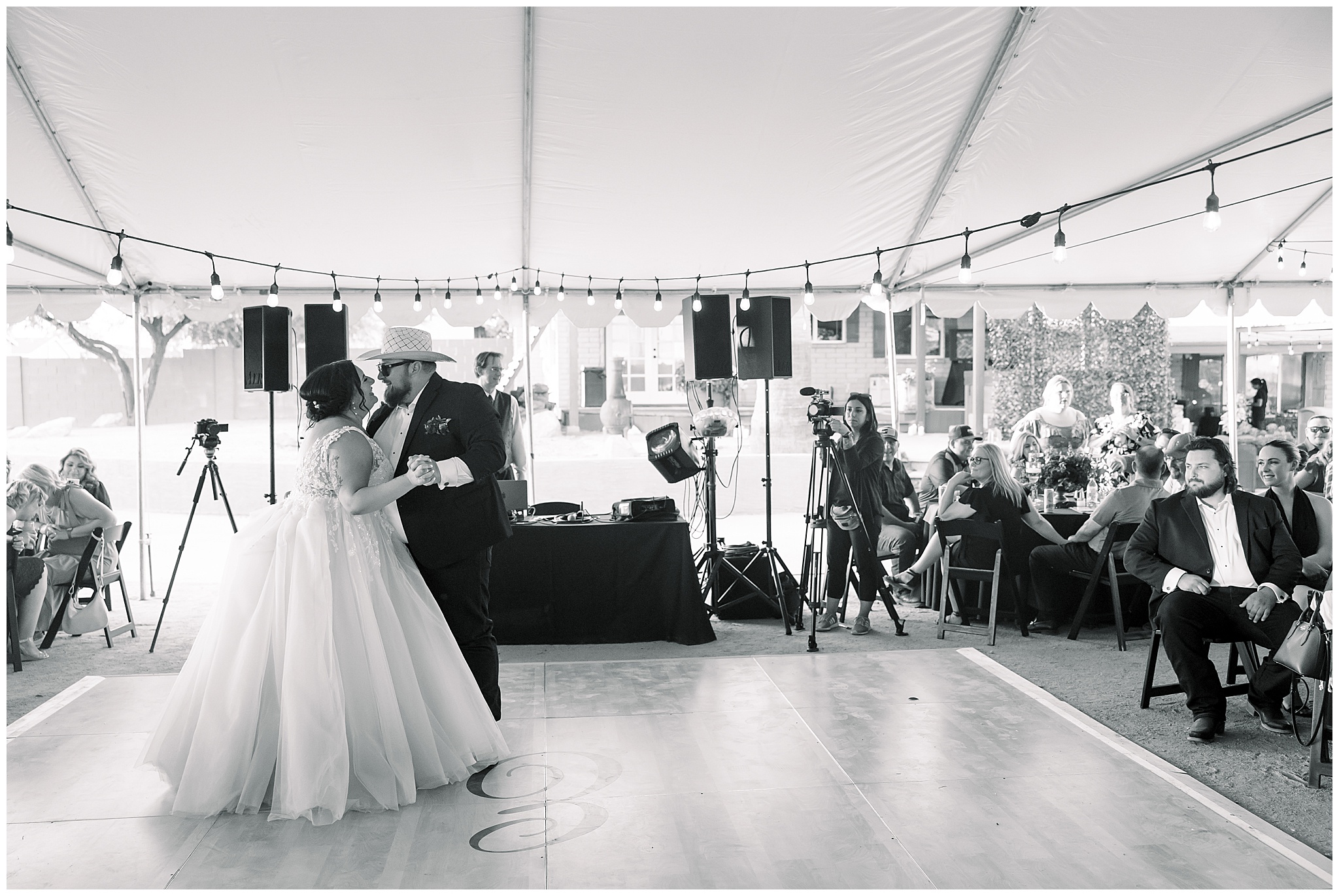 Black and white photo of bride and grooms first dance